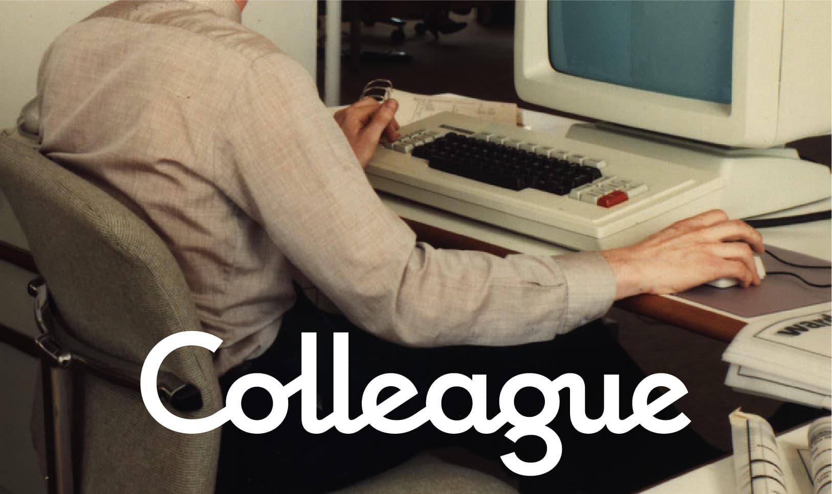 Colleague logo over a person working at a vintage computer